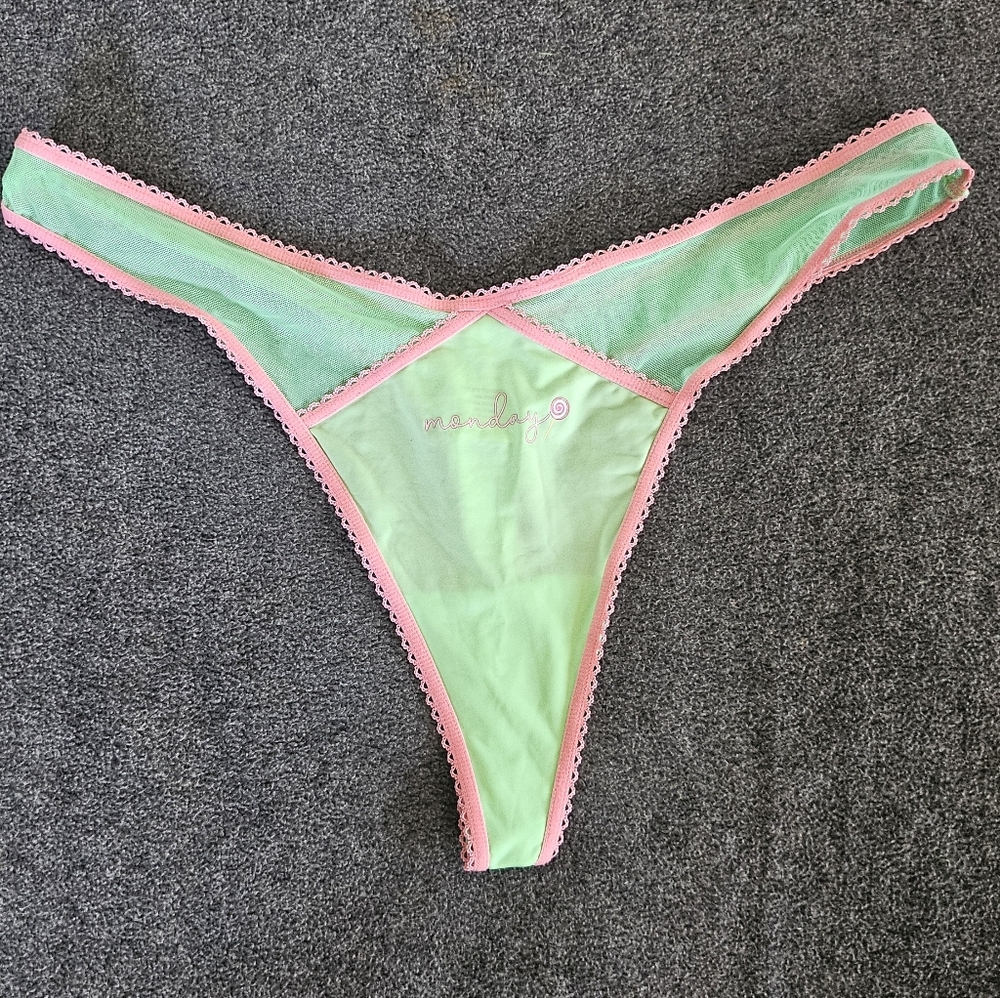 New without tags, parade green and pink thong.  Size medinum to large
